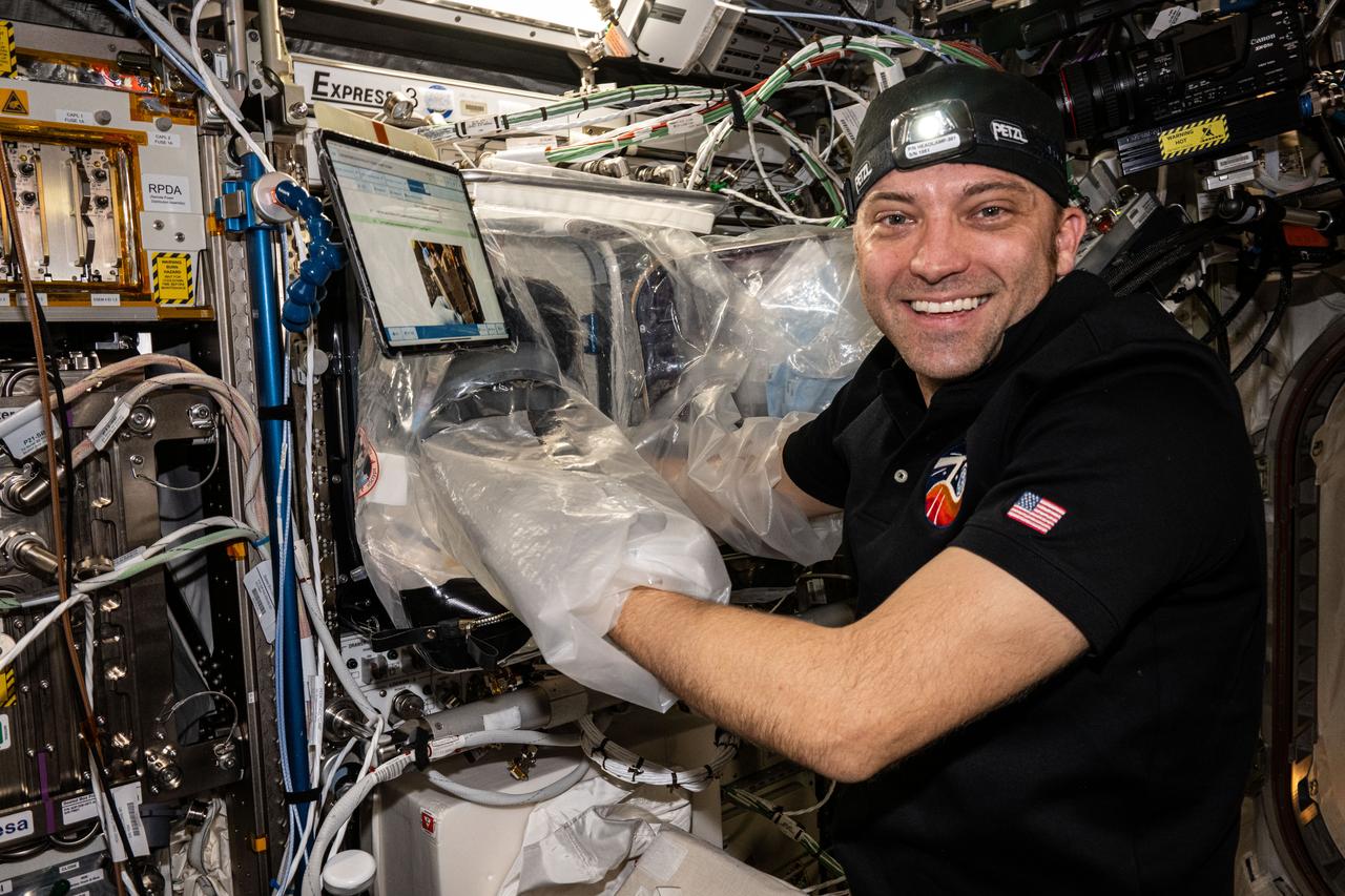iss071e006125 (April 9, 2024) --- Expedition 70 Flight Engineer and NASA astronaut Matthew Dominick works inside the BioFabrication Facility using the portable glovebag aboard the International Space Station's Columbus laboratory module. He was working on the Redwire Cardiac Bioprinting Investigation that may offer the ability to print food and medicines for future space crews. Results may also enable the bioprinting of replacement organs and tissues potentially alleviating the shortage of donor organs on Earth.