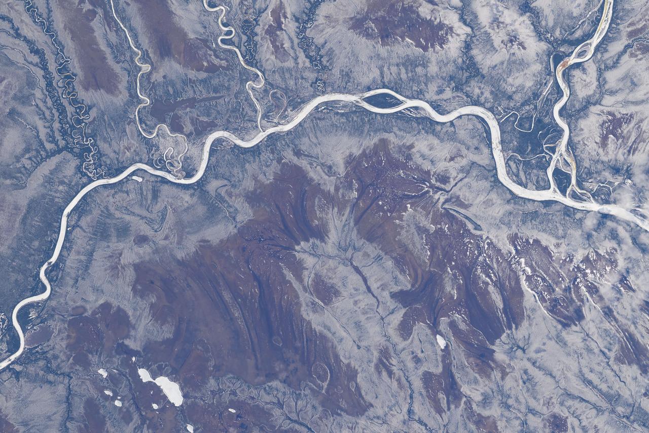 iss071e007986 (April 13, 2024) --- The Kenogami River, at the mouth of the Albany River (far right), is pictured in the Canadian province of Ontario from the International Space Station as it orbited 261 miles above North America.