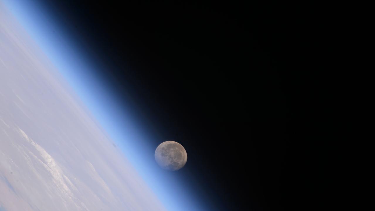 iss071e046097 (April 27, 2024) --- The waning gibbous Moon begins setting below Earth's horizon in this photograph from the International Space Station as it orbited 258 miles above China.