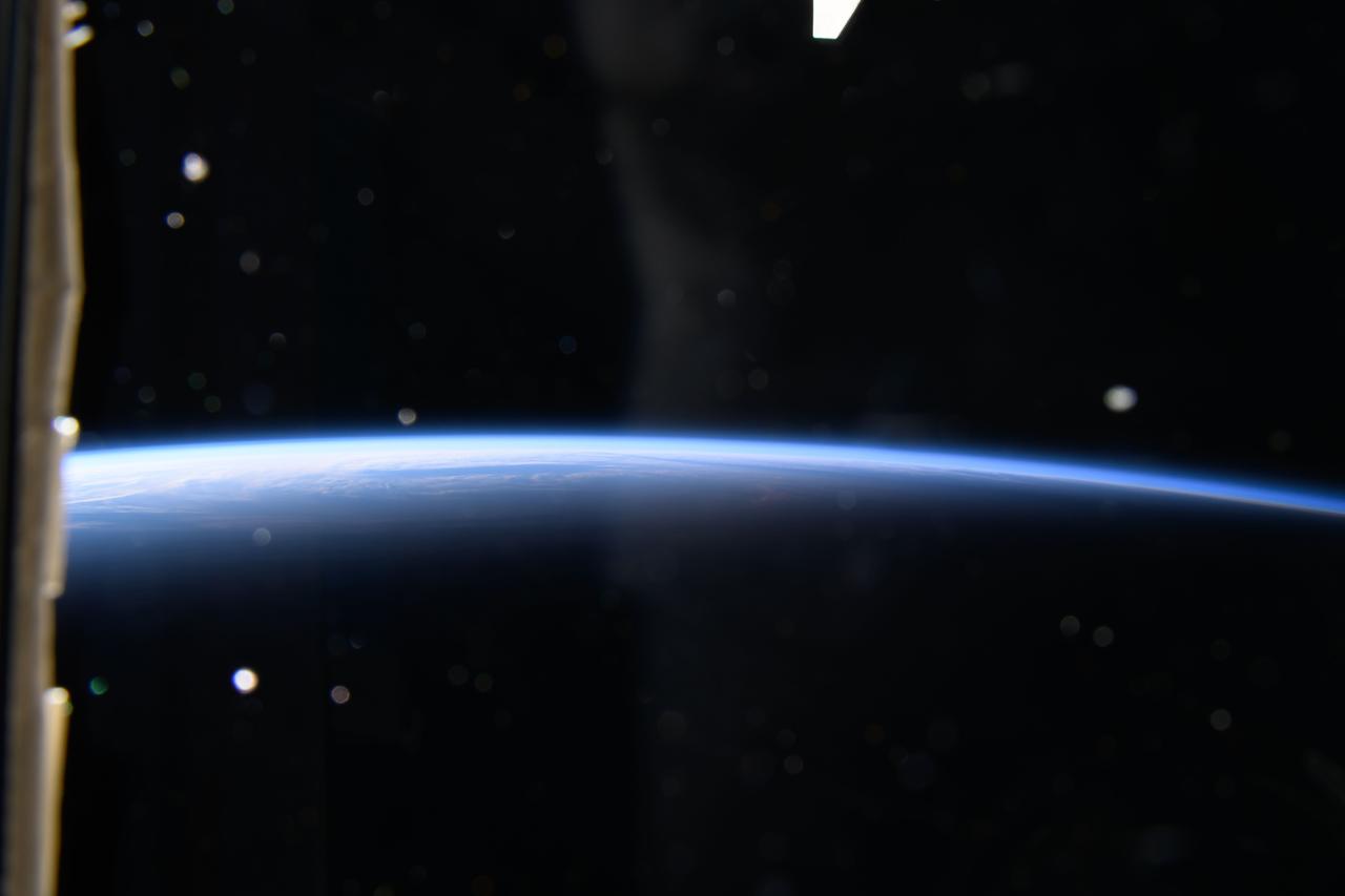 iss071e047733 (April 29, 2024) -- While orbiting nearly 260 miles above the North Pacific Ocean, the International Space Station soars from orbital nighttime into orbital daytime.