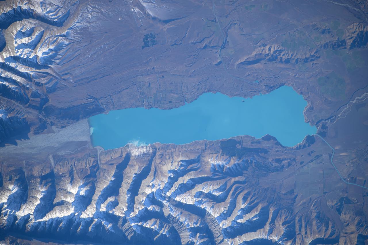 iss071e073562 (May 11, 2024) --- Lake Pukaki, fed by the Tasman River and south of Aoraki/Mount Cook in the Southern Alps, is pictured from the International Space Station as it orbited 266 miles above New Zealand.