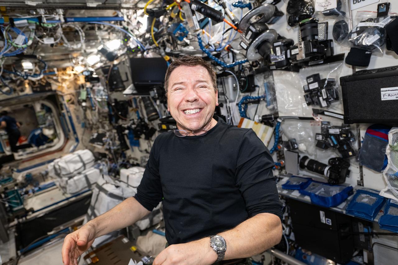 iss071e077892 (May 15, 2024) --- Expedition 71 Flight Engineer and NASA astronaut Mike Barratt smiles for a portrait aboard the International Space Station's Destiny laboratory module.