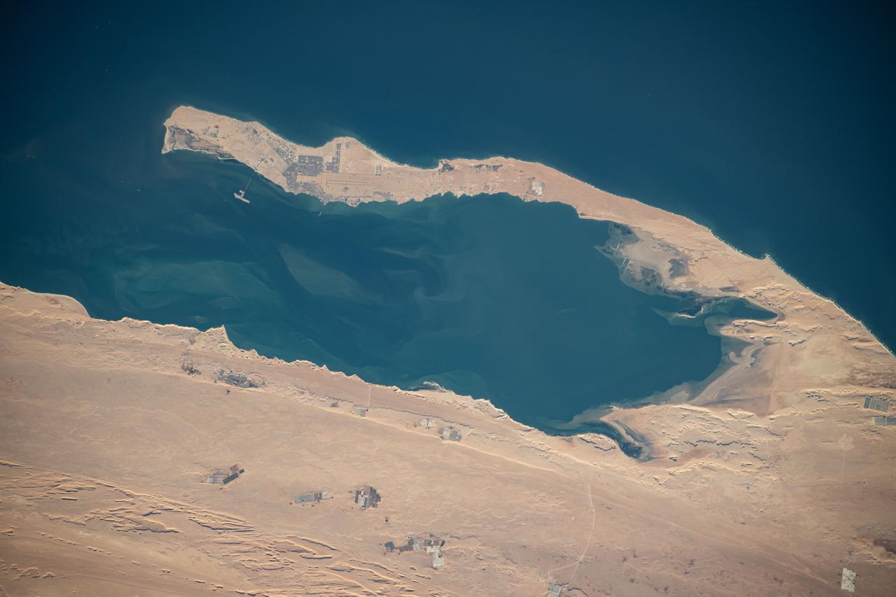 iss071e082709 (May 16, 2024) --- Dakhla Bay on the coast of Western Sahara is pictured from the International Space Station as it orbited 259 miles above the Atlantic Ocean.