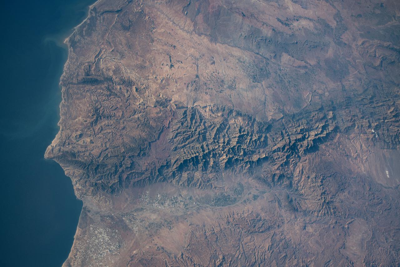 iss071e082775 (May 16, 2024) --- The Atlas Mountain range rises on the Atlantic coast of Morocco and extends east to the North African nations of Algeria and Tunisia. The International Space Station was orbiting 258 miles above the Moroccan coast at the time of this photograph.