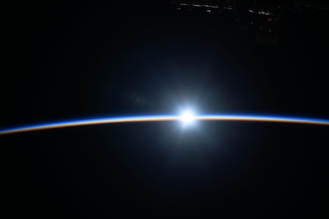 iss071e091223 (May 19, 2024) --- The last rays of an orbital sunset shine like a diamond while fading below Earth's atmosphere as the International Space Station soared 263 miles above the Pacific Ocean off the east coast of New Zealand.