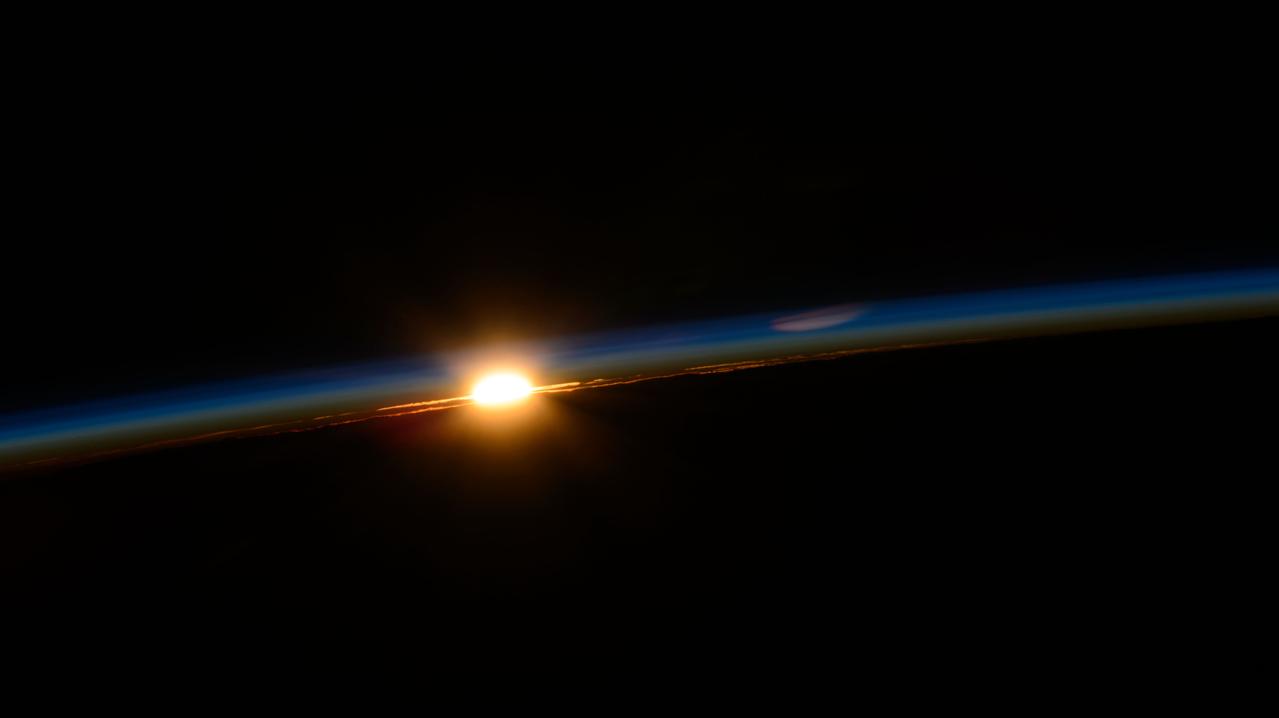 iss071e092499 (May 19, 2024) --- The first rays of an orbital sunrise penetrate Earth's atmosphere revealing the cloud tops as the International Space Station soared 262 miles above the Indian Ocean off the southeast coast of South Africa.