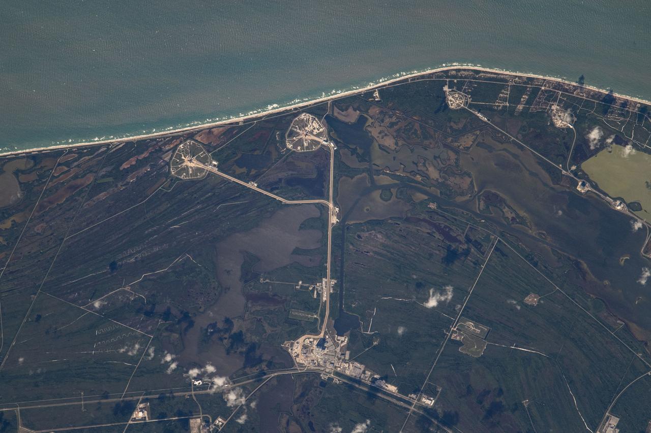 iss071e104917 (May 20, 2024) --- Kennedy Space Center's Launch Pads 39A and 39B on Florida's Merritt Island are clearly visible in this photograph from the International Space Station as it orbited 259 miles above the Atlantic Ocean.