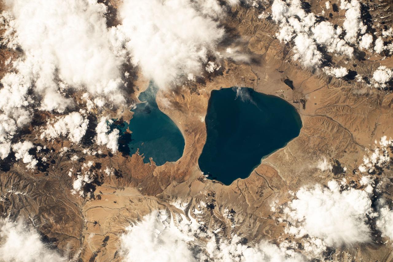   iss071e111824 (May 23, 2024) -- As the International Space Station orbited 257 miles above Tibet, Lake Manasarovar (right) and Lake Rakshastal (left) were photographed. Fed by the Kailash Glaciers, Manasarovar is a high-altitude freshwater lake, connected to its neighboring saltwater lake by the Ganga Chhu river.