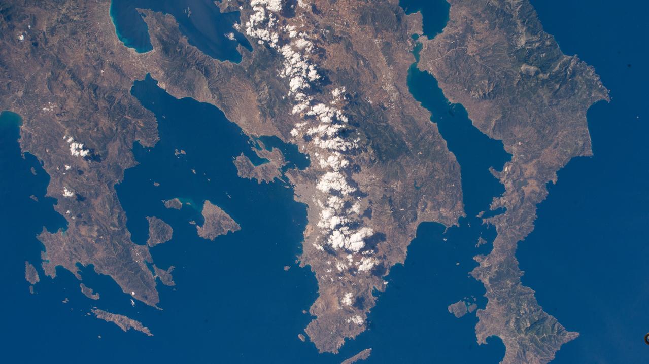 iss071e112065 (May 23, 2024) --- A partly cloudy Athens, Greece (center), on the Saronic Gulf, is pictured from the International Space Station as it orbited 259 miles above the Aegean Sea.