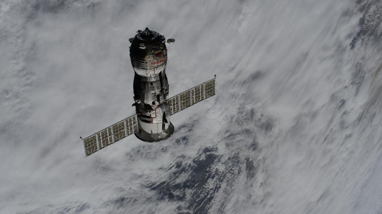 iss071e124982 (May 28, 2024) --- The uncrewed Roscosmos Progress 86 cargo craft, packed with trash and obsolete gear, departs the vicinity of the International Space Station after undocking from the Poisk module ending a six-month cargo mission.