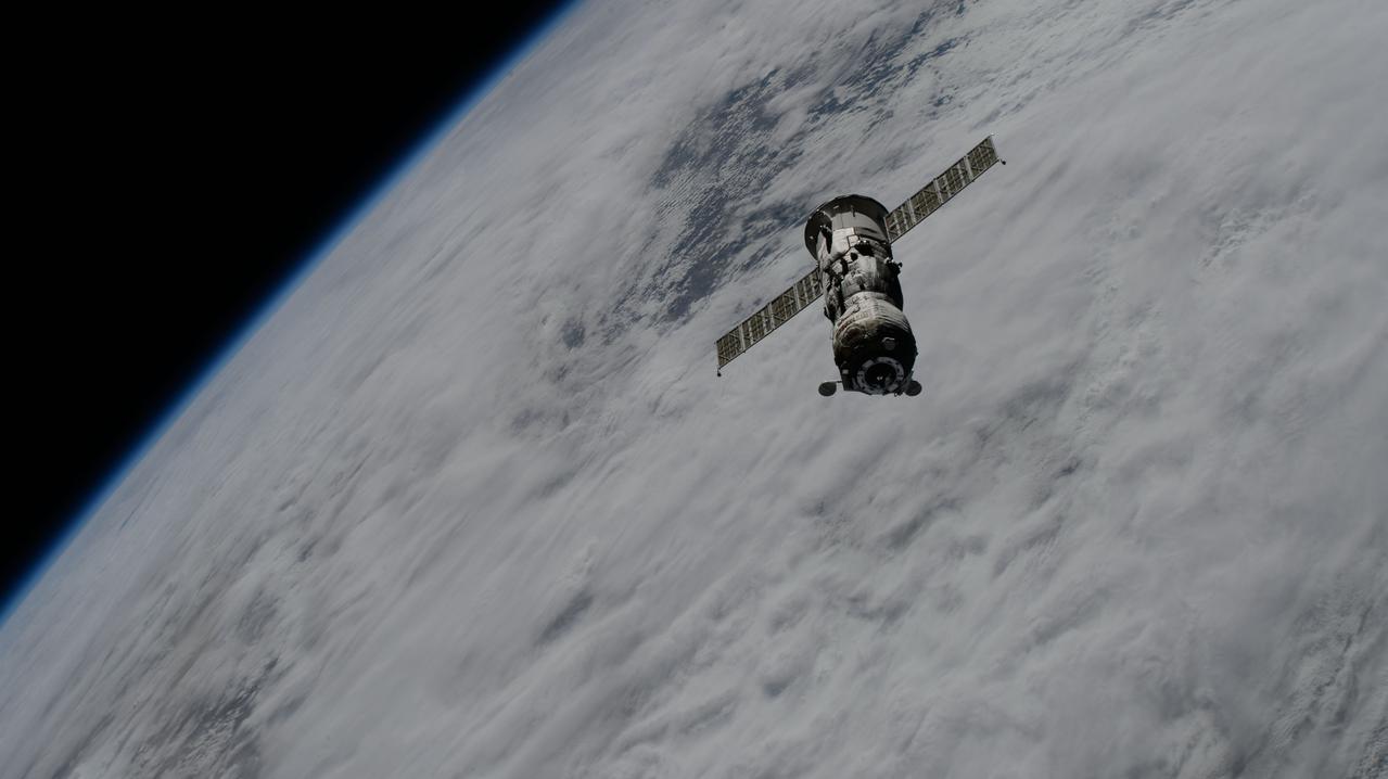 iss071e124983 (May 28, 2024) --- The uncrewed Roscosmos Progress 86 cargo craft, packed with trash and obsolete gear, departs the vicinity of the International Space Station after undocking from the Poisk module ending a six-month cargo mission.