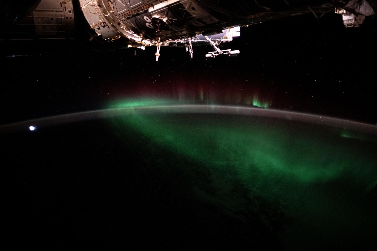 iss071e161819 (June 3, 2024) --- The aurora australis, also known as the Southern Lights, shimmers over the Indian Ocean in between Australia and Antarctica in this photograph from the International Space Station as it orbited 266 miles above.