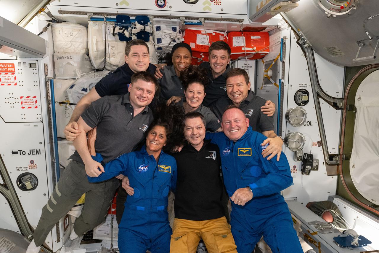 iss071e171061 (June 6, 2024) --- The seven Expedition 71 crew members gather with the two Crew Flight Test members for a team portrait aboard the space station. In the front from left are, Suni Williams, Oleg Kononenko, and Butch Wilmore. Second row from left are, Alexander Grebenkin, Tracy C. Dyson, and Mike Barratt. In the back are, Nikolai Chub, Jeanette Epps, and Matthew Dominick.