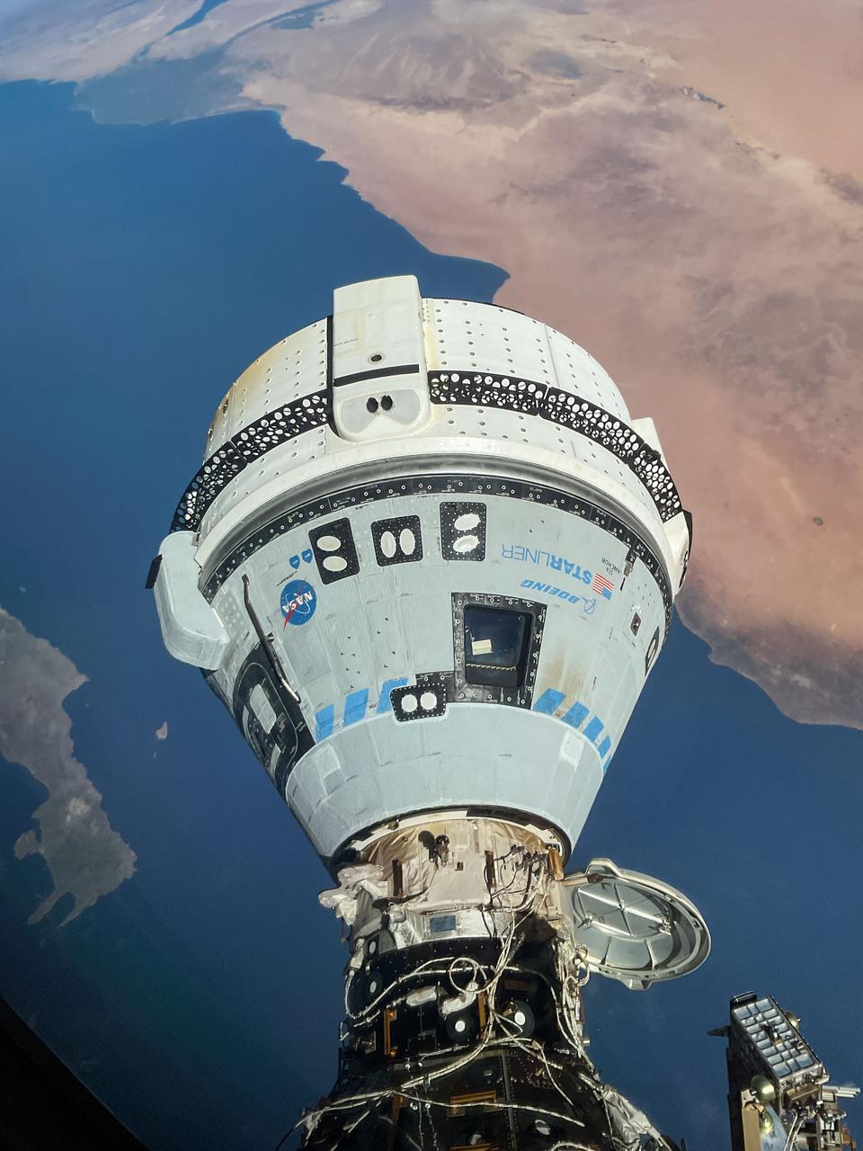 iss071e182982 (June 13, 2024) --- The Starliner spacecraft on NASA's Boeing Crew Flight Test is pictured docked to the Harmony module's forward port as the International Space Station orbited 263 miles above the Mediterranean Sea.