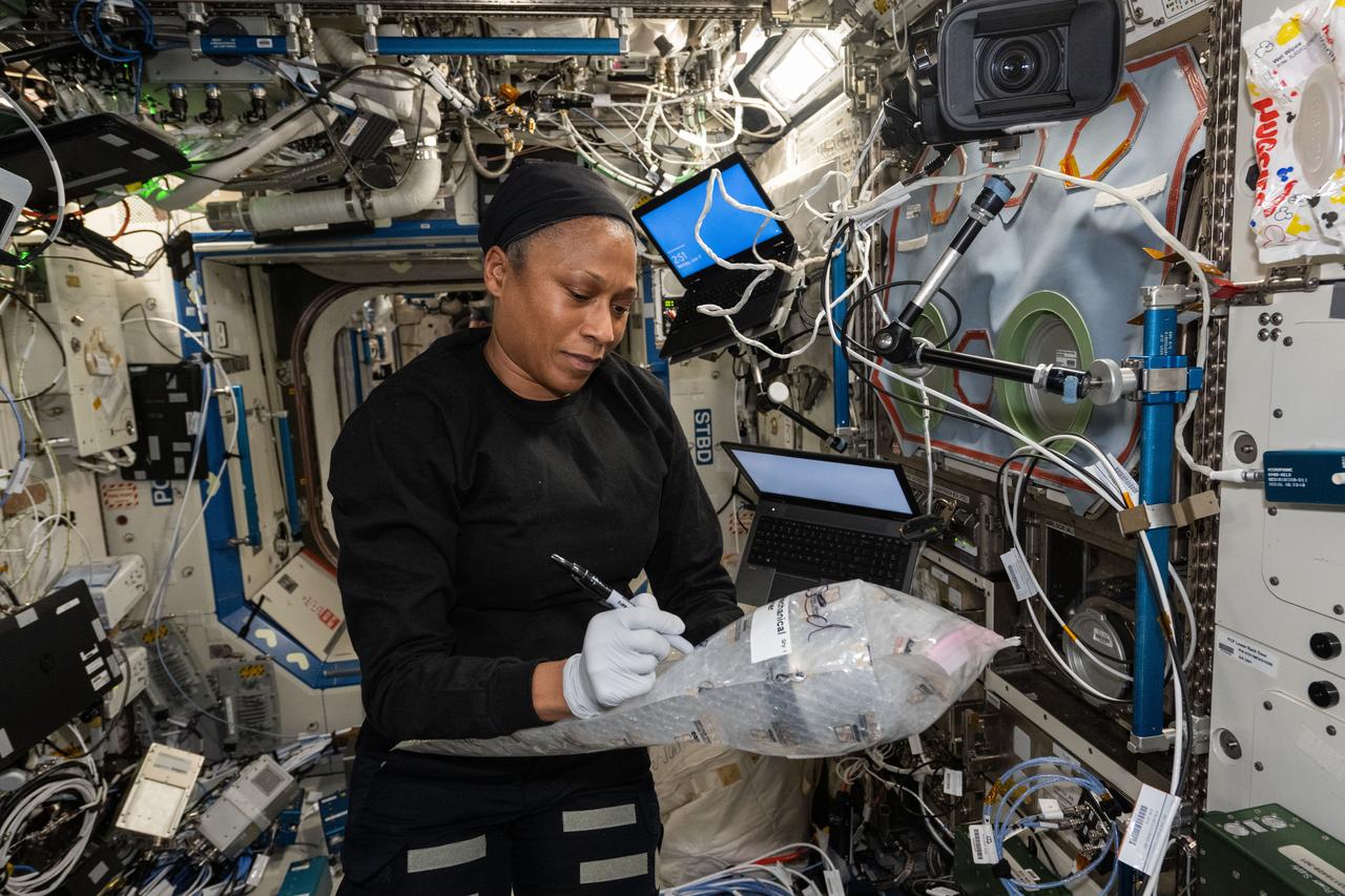 iss071e195830 (June 17, 2024) --- NASA astronaut and Expedition 71 Flight Engineer Jeanette Epps documents research hardware while working in the International Space Station's Destiny laboratory module.