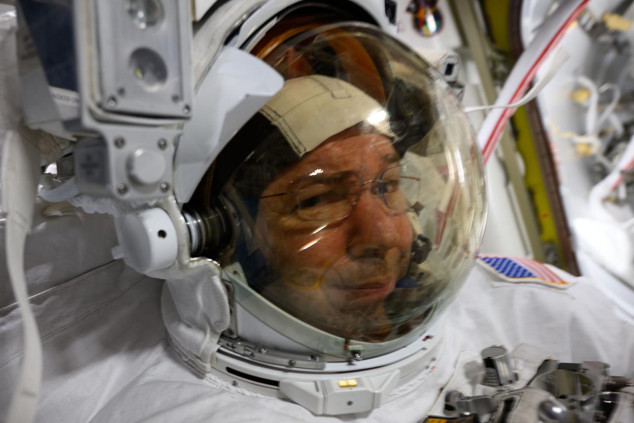 iss071e207742 (June 24, 2024) --- NASA astronaut and Expedition 71 Flight Engineer Mike Barratt is pictured in his spacesuit prior to the start of a science and maintenance spacewalk that ended early on June 24, 2024, after fellow astronaut and flight engineer Tracy C. Dyson's (out of frame) spacesuit experienced a water leak in the service and cooling umbilical unit.