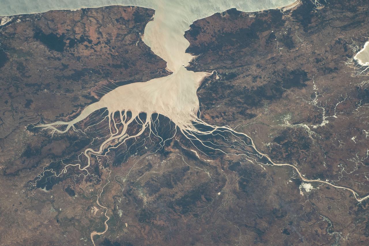 iss071e218073 (June 27, 2024) --- Helodrano Mahajambe, a bay in northwestern Madagascar, opens into the Atlantic Ocean in this photograph from the International Space Station as it orbited 267 miles above the East African island nation.