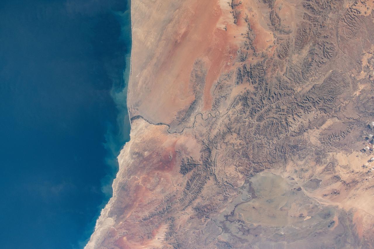 iss071e230735 (June 27, 2024) --- Orange River is the border between South Africa and Namibia on the Atlantic coast and is the termination point of the Namib desert to the north and the desert landscape of Richtersveld to the south. The International Space Station was orbiting 268 miles above at the time of this photograph