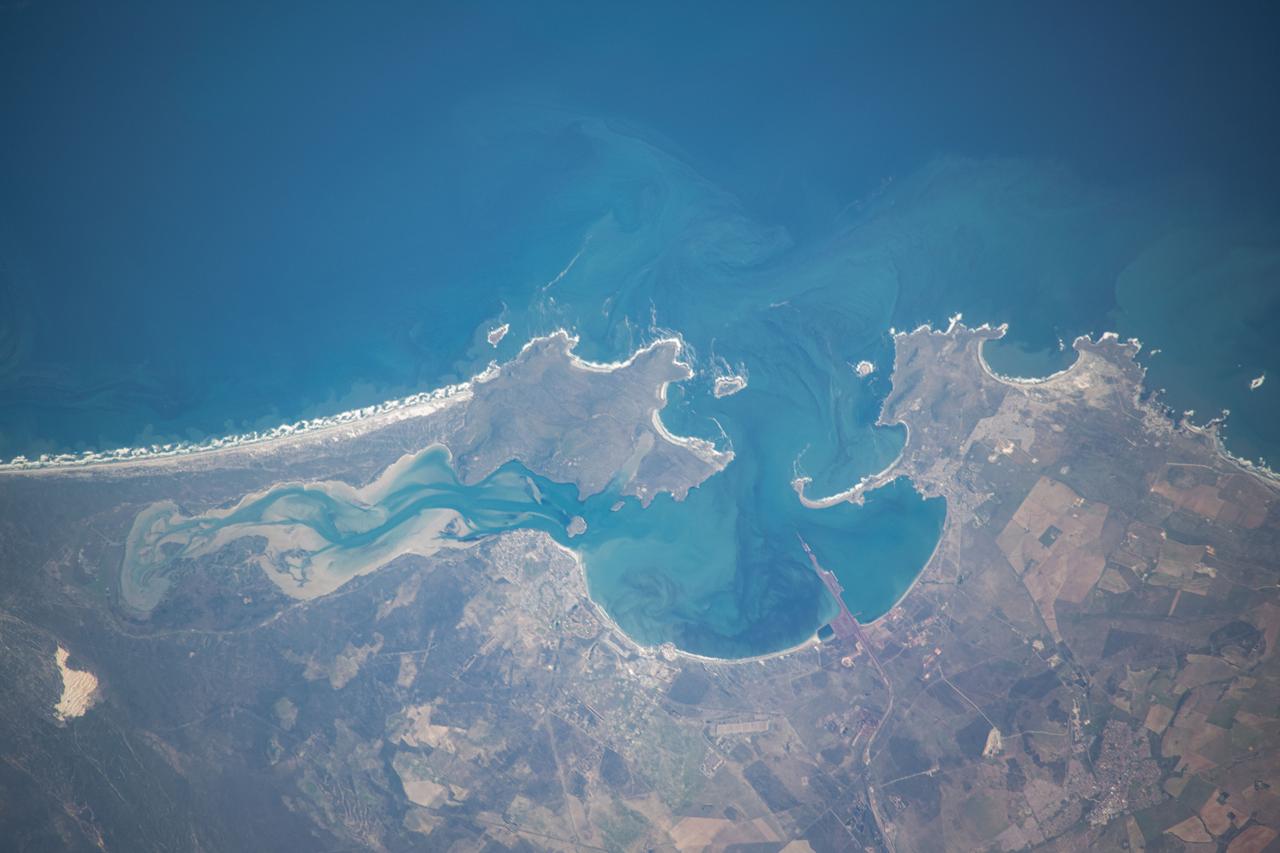 iss071e230761 (June 27, 2024) --- The Saldanha Bay, part of South Africa's West Coast Narional Park Marine Preserve, leads into the Atlantic Ocean in this photograph from the International Space Station as it orbited 269 miles above.