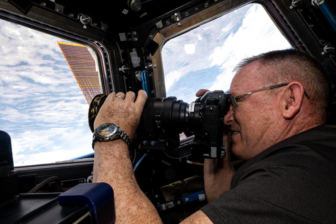 iss071e256908 (June 29, 2024) --- NASA astronaut and Boeing Crew Flight Test Commander Butch Wilmore points his camera outside the cupola and photographs Earth landmarks 263 miles below the International Space Station.