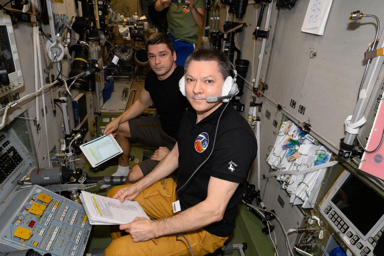 iss071e294839 (June 1, 2024) --- Expedition 71 Commander Oleg Kononenko (foreground) and Flight Engineer Nikolai Chub, both Roscosmos cosmonauts, are pictured inside the International Space Station's Zvezda service module monitoring the automated rendevous and docking of the Progress 88 cargo craft to the Poisk module. The duo was at the controls of Zvezda's TORU, or telerobotically-operated rendezvous unit, ready to take remote control of the Progress 88, packed with about three tons of food, fuel, and supplies for the Expedition 71 crew, in the unlikely event the spacecraft would be unable to dock on its own.