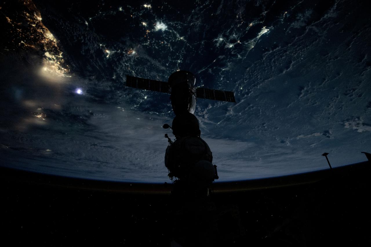 iss071e373018 (July 18, 2024) --- Silhouetted against the backdrop of the Earth below, is the Soyuz MS-25 crew ship docked to the Prichal docking module during an orbital nighttime pass. The International Space Station was soaring 261 miles above Jakarta on Indonesia's island of Java at the time of this photograph.