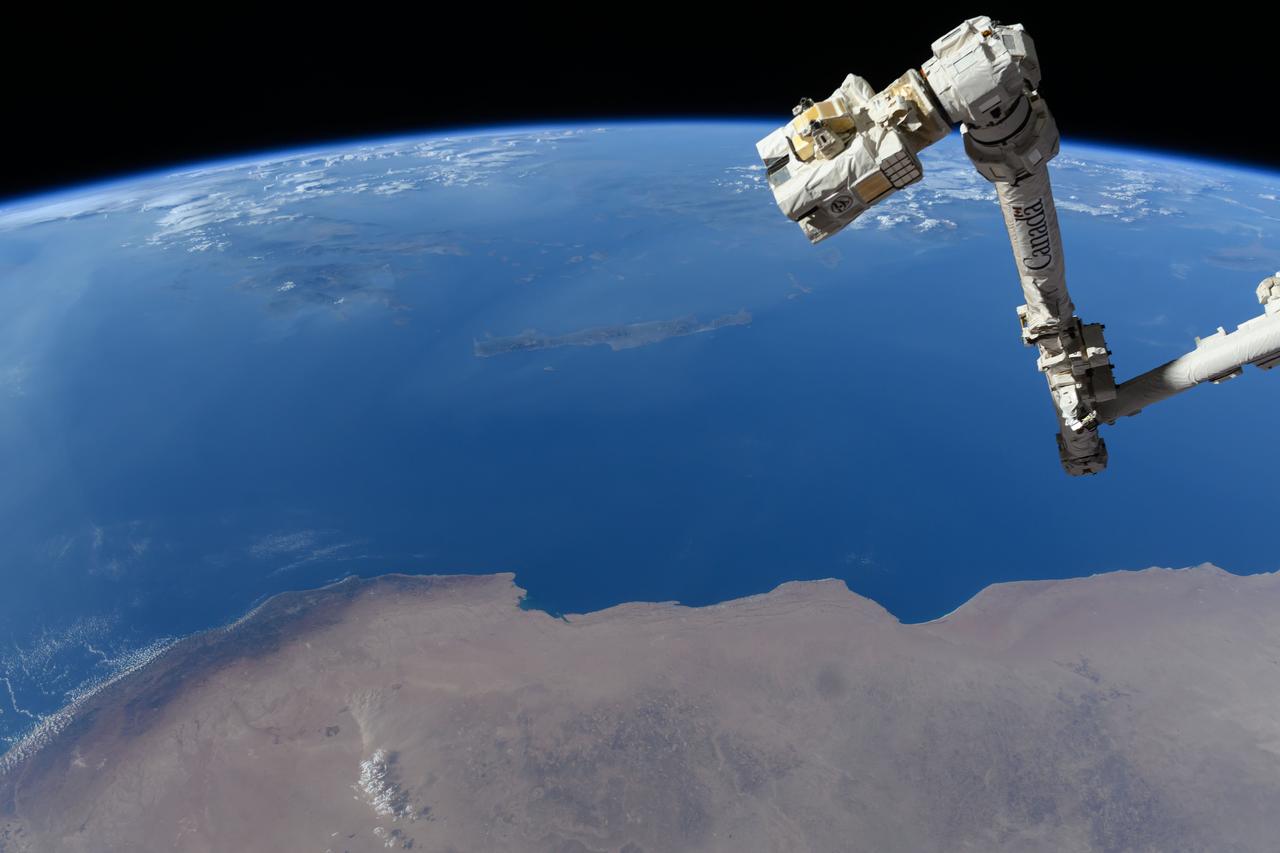 iss071e384199 (July 17, 2024) --- The Canadarm2 robotic arm's latching end effector, or LEE, is used to grapple fixtures on the International Space Station, as well as capture the approaching Cygnus cargo craft from Northrop Grumman and attach it to the Unity module for cargo transfer operations. 256 miles below the outpost is the Mediterranean coast of Libya and Egypt and the Greek island of Crete.