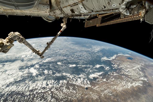 NASA image: The 57.7-foot-long Canadarm2 robotic arm extends from the International Space Station