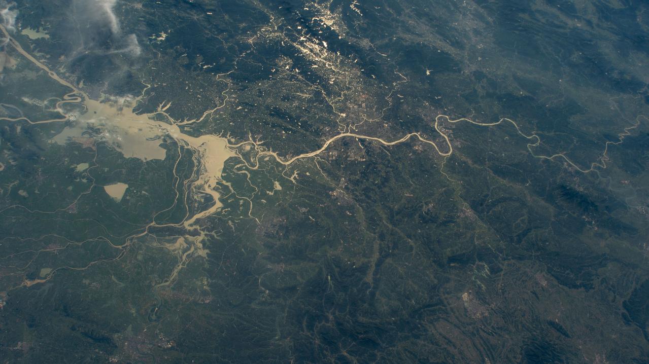 iss071e439833 (Aug. 8, 2024) --- Xiang River runs through the city of Changsha (center) in China's province of Hunan. At far left, the city of Yueyang lies on the bank of Dongdongting Lake in Hunan's humid, subtropical region. The International Space Station was orbiting 262 miles above the Asian nation at the time of this photograph.