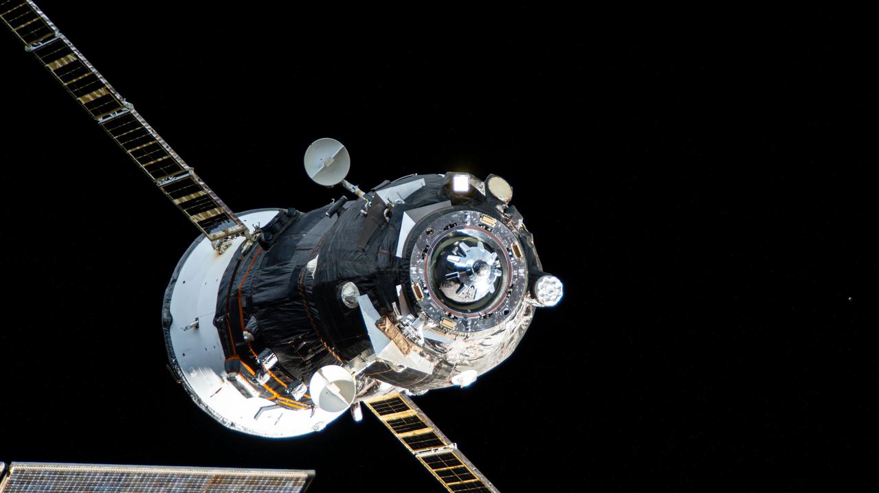 iss071e464295 (Aug. 13, 2024) --- The Progress 87 cargo craft, packed with trash and discarded gear, departs the International Space Station following a six-month resupply mission docked to the Zvezda service module's rear port.