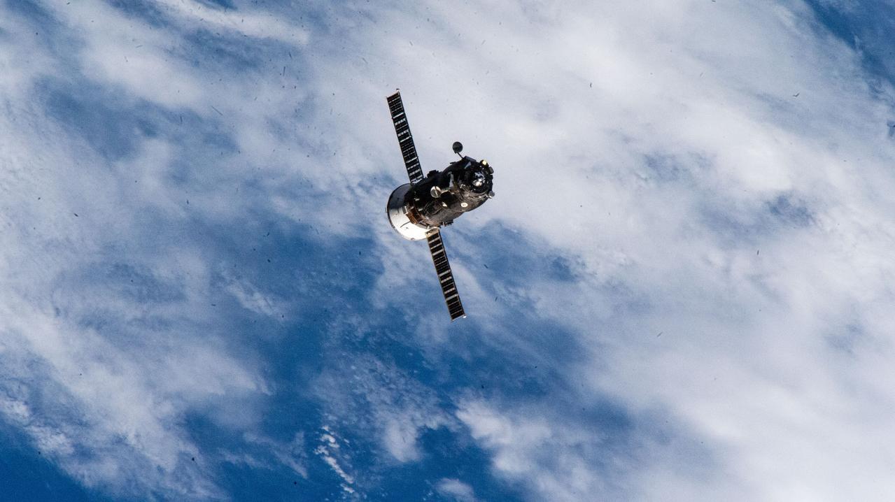 iss071e464298 (Aug. 13, 2024) --- The Progress 87 cargo craft, packed with trash and discarded gear, departs the International Space Station following a six-month resupply mission docked to the Zvezda service module's rear port.