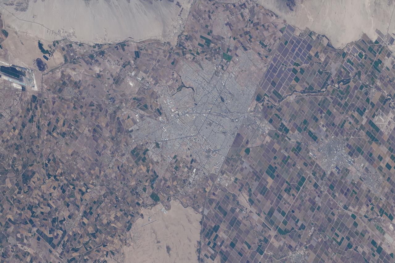 iss071e488809 (Aug. 14, 2024) --- Mexicali, the capital of the Mexican state of Baja California in the fertile Imperial Valley with a population of just over 1,000,000 bordering the American state of California, is pictured from the International Space Station as it orbited 258 miles above.
