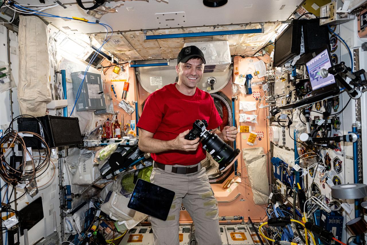 iss071e513872 (Aug. 10, 2024) --- NASA astronaut and Expedition 71 Flight Engineer Matthew Dominick smiles for a portrait during photography duties aboard the International Space Station's Destiny laboratory.