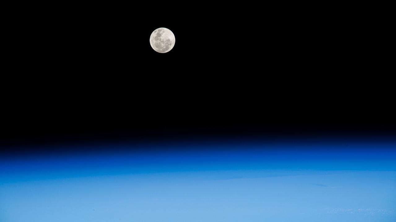 iss071e515447 (Aug. 19, 2024) --- The Full Moon pictured above Earth's horizon as the International Space Station soared 262 miles above the Atlantic Ocean off the coast of South Africa northwest of Cape Town.