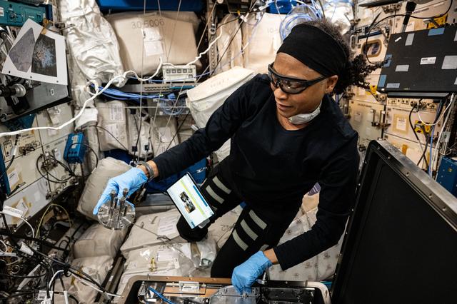 NASA image: NASA astronaut Jeanette Epps configures the Metal 3D printer