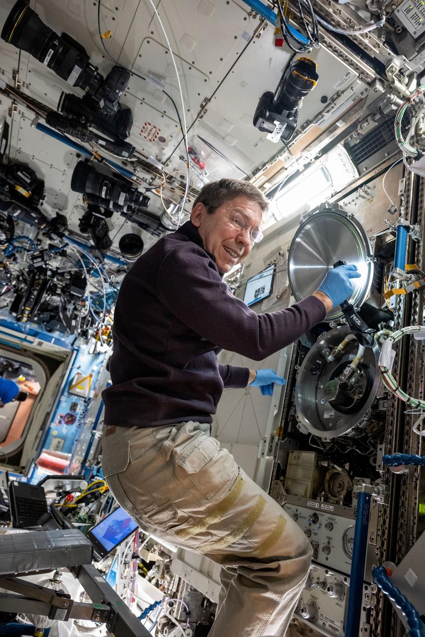 iss071e522745 (Aug. 19, 2024) --- NASA astronaut and Expedition 71 Flight Engineer Mike Barratt swaps sample cartridges inside the Materials Science Laboratory (MSL), a research furnace facilitating discoveries of new and improved materials as well as new uses for existing materials such as metals, alloys, polymers, and more. The MSL is located inside the International Space Station's Destiny laboratory module.