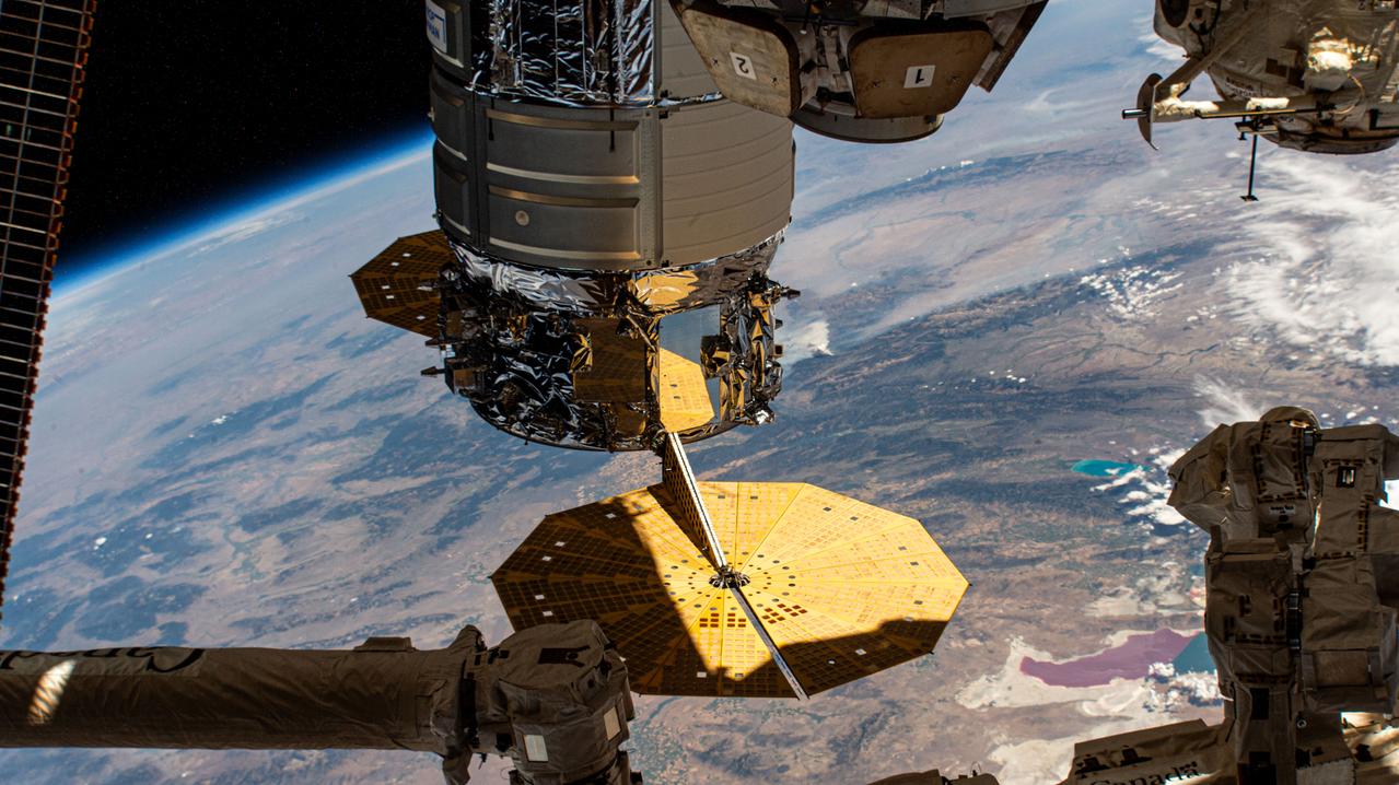 iss071e5472276 (Aug. 22, 2024) --- Northrop Grumman's Cygnus space freighter is pictured berthed to the International Space Station's Earth-facing port on the Unity module. At lower right, is Utah's Great Salt Lake divided by a causeway that separates the lake into two colors, red and green, due to different types of algae grwoing on either side. The orbital outpost was soaring 260 miles above the southwestern United States at the time of this photograph.