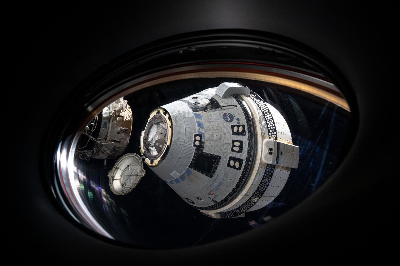 iss071e614117 (Sept. 6, 2024) --- Boeing's uncrewed Starliner spacecraft is pictured from a window aboard the SpaceX Dragon Endeavour spacecraft shortly after undocking from the International Space Station's forward port on the Harmony module.