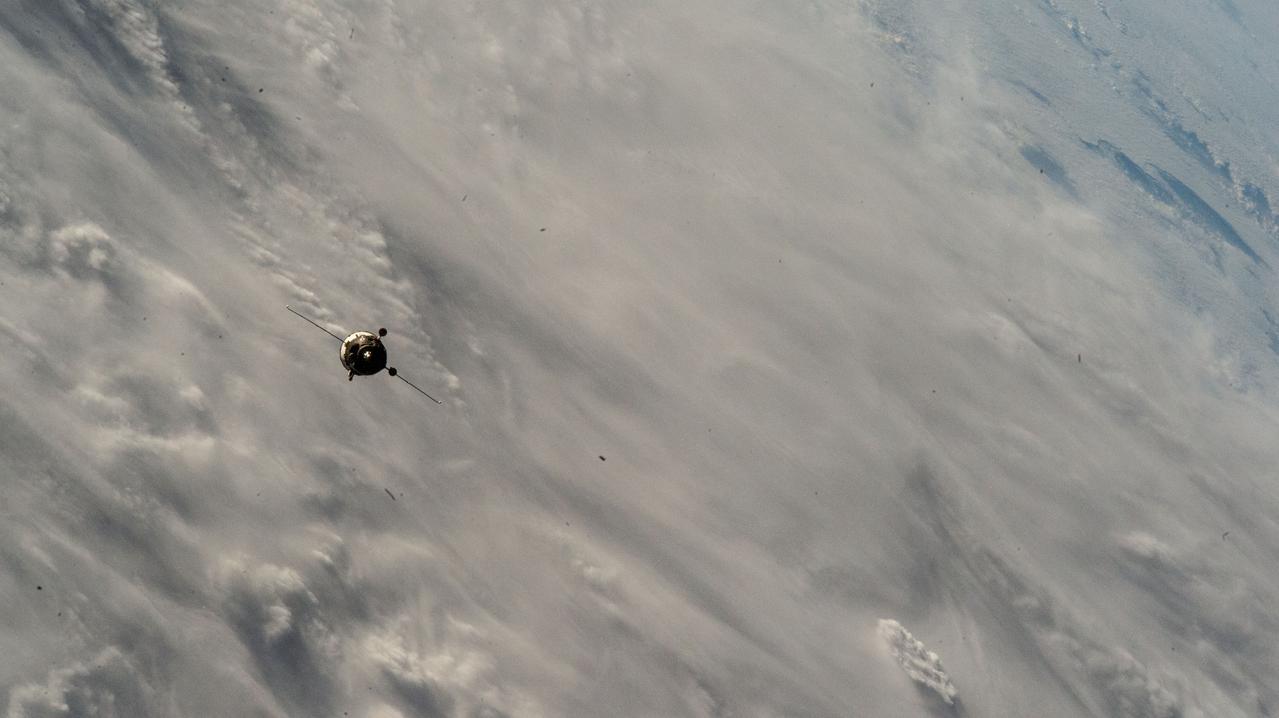 iss071e629831 (Sept. 11, 2024) --- The Soyuz MS-26 spacecraft carrying NASA astronaut Don Pettit and Roscosmos cosmonauts Alexey Ovchinin and Ivan Vagner approaches the International Space Station 258 miles above a cloudy Atlantic Ocean.