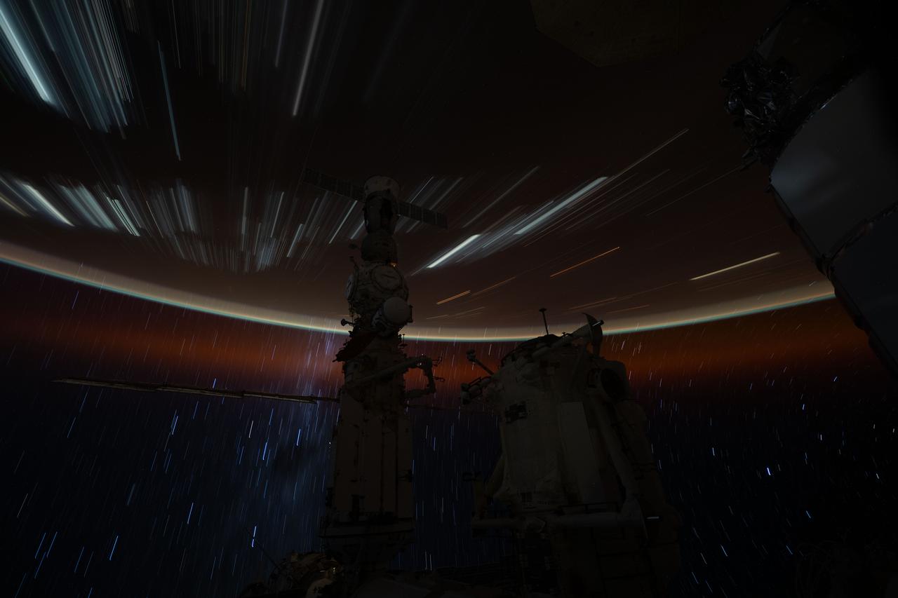 iss071e662620 (Sept. 2, 2024) --- This long exposure photograph taken by NASA astronaut Matthew Dominick with a camera programmed for low sensitivity shows star trails and streaks of city lights as the International Space Station orbited 257 miles above the Molucca Sea in Indonesia.