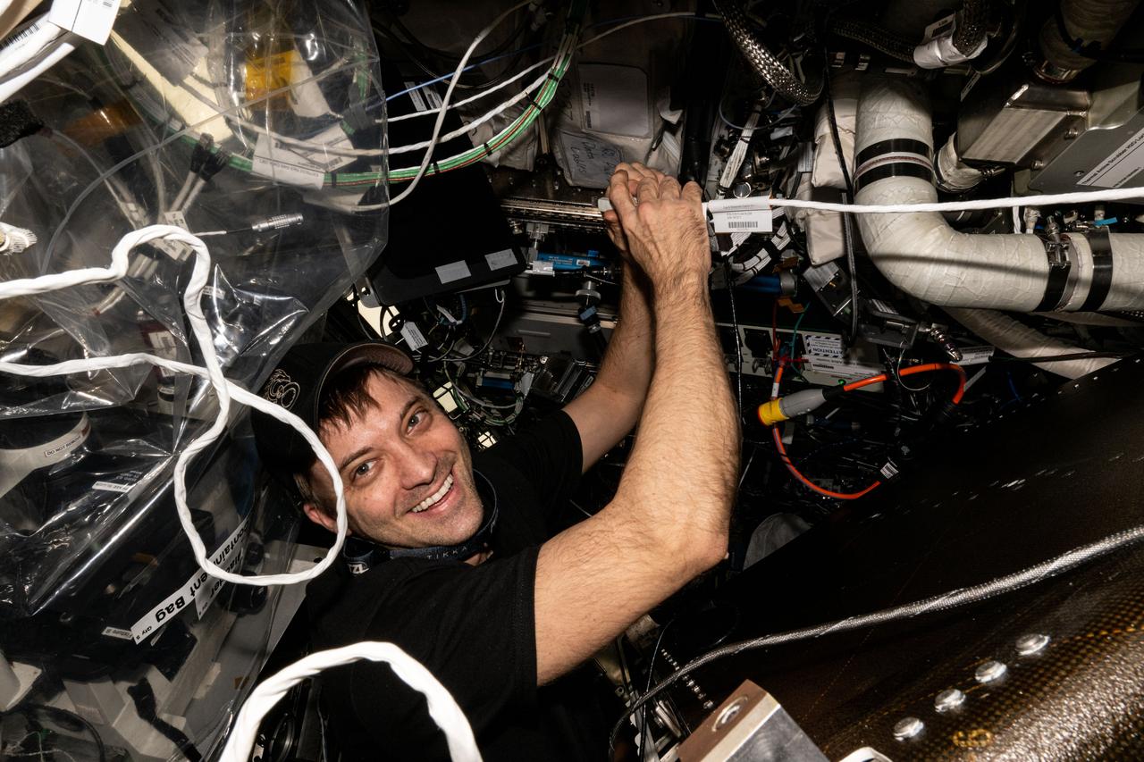 iss071e673567 (Sept. 17, 2024) --- NASA astronaut and Expedition 71 Flight Engineer Matthew Dominick works on an oxygen genarator and prepares the advanced life support device for hardware replacements aboard the International Space Station's Destiny laboratory module.