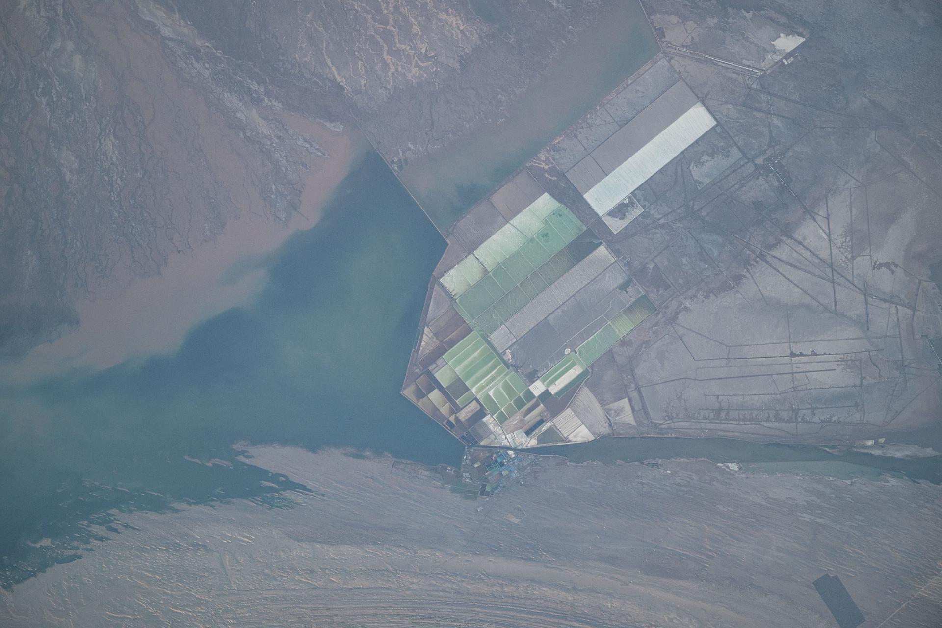 West Taijinar salt lake in China is pictured from the International Space Station as it orbited 260 miles above the Asian nation.939D2224.NEF