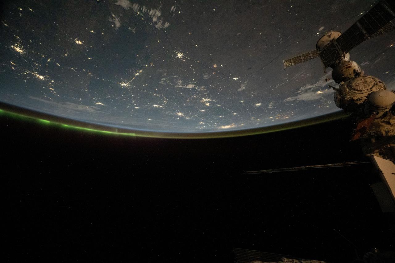 iss071e695419 (Sept. 16, 2024) --- The city lights of central Asia and an aurora crowning Earth's horizon are pictured in this photograph from the International Space Station as it orbited 264 miles above western Kazakhstan.