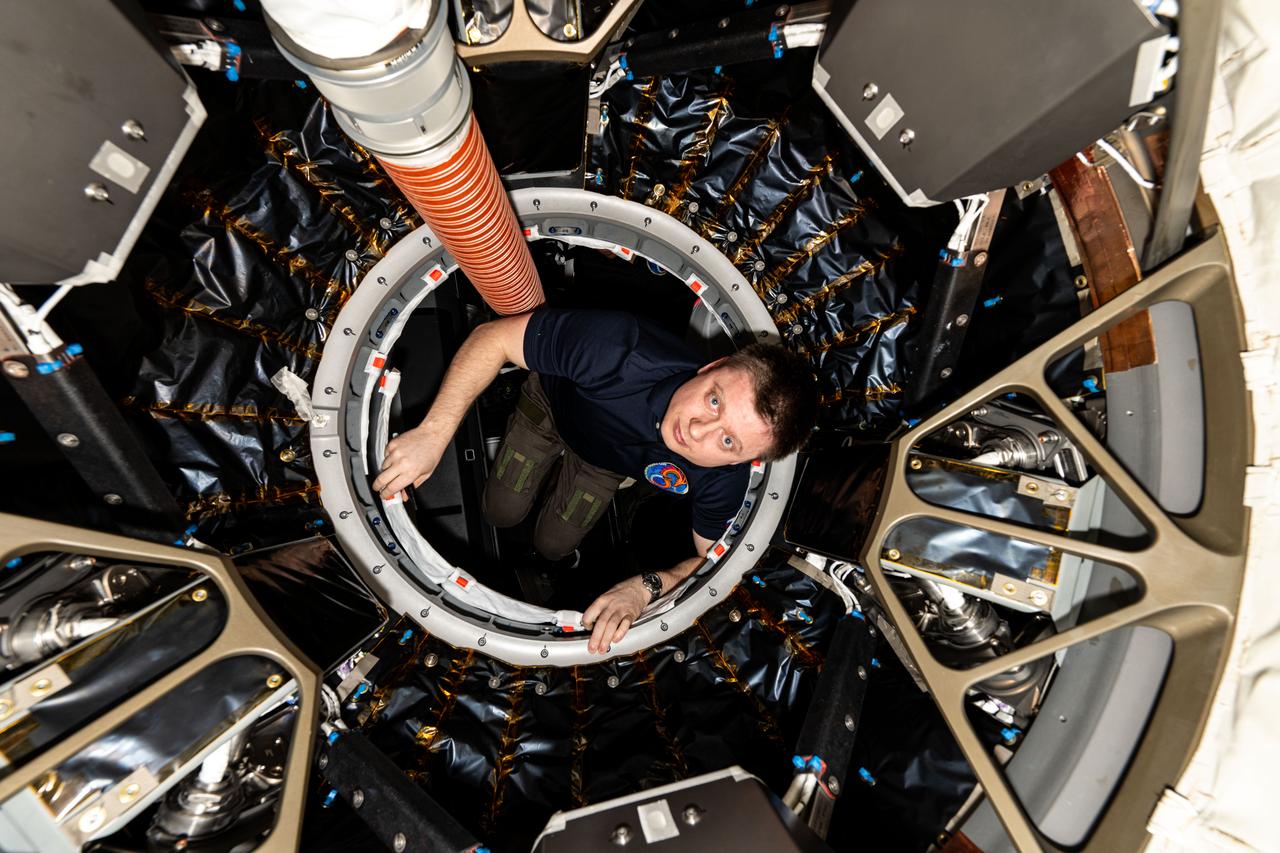 iss072e005775 (Sept. 28, 2024) --- Roscosmos cosmonaut and Expedition 72 Flight Engineer Alexander Grebenkin is pictured inside the vestibule between the SpaceX Dragon Endeavour spacecraft and the Harmony module's space-facing port on the International Space Station.