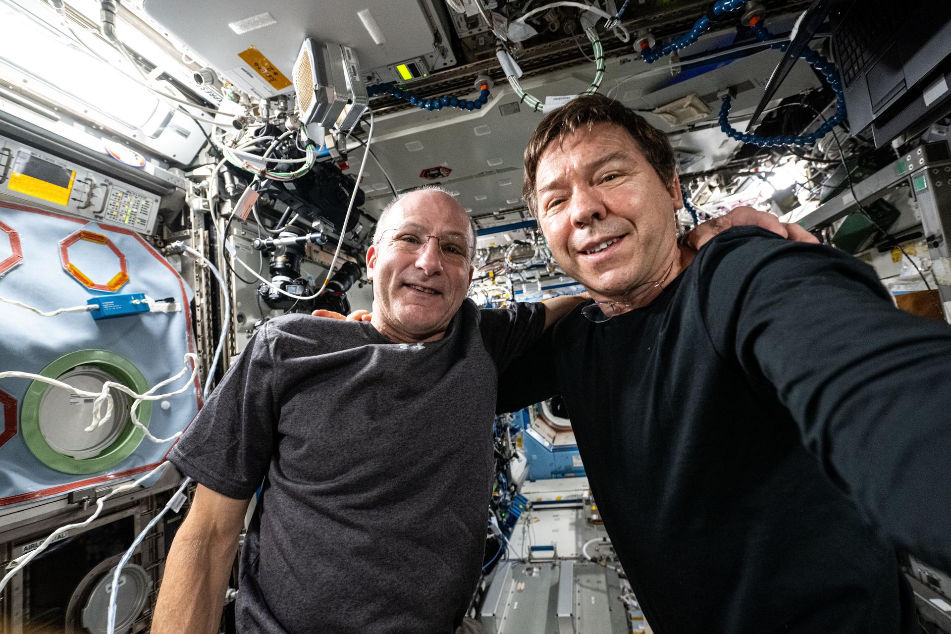 Expedition 72 Flight Engineers (from left) Don Pettit and Mike Barratt, both NASA astronauts, pose for a portrait together aboard the International Space Station's Destiny laboratory module.