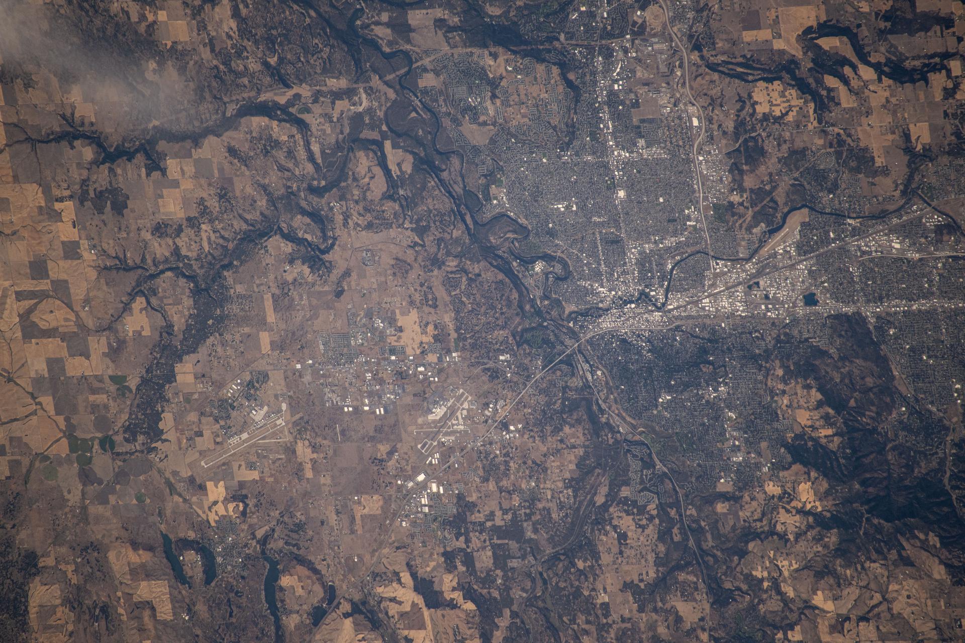 Spokane River runs through Spokane, Washington, a city with a population of about 229,000 and just west of the Idaho state line, in this photograph from the International Space Station as it orbited 259 miles above North America.