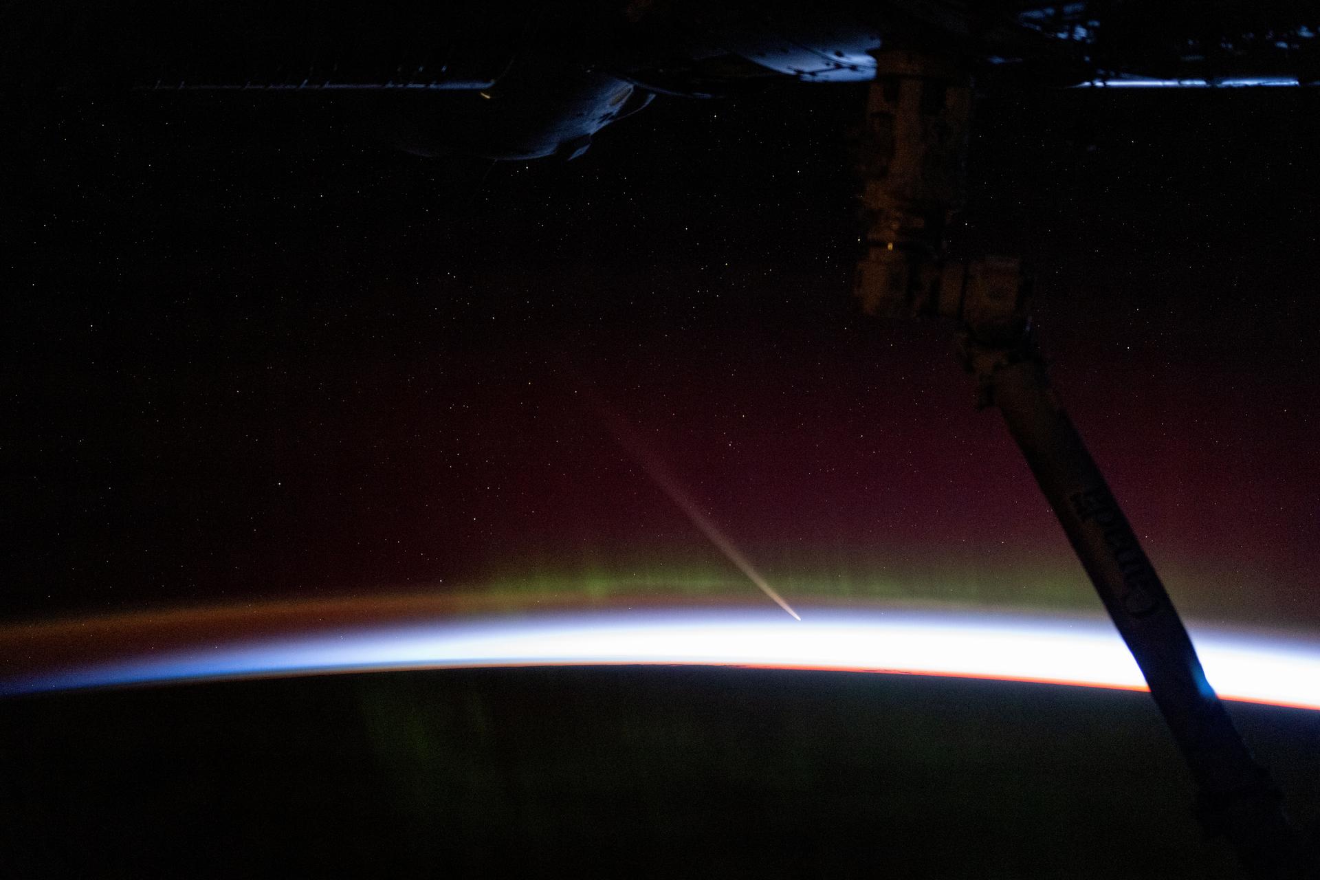 Comet C/2023 A3 Tsuchinshan-ATLAS was about 44 million miles away from Earth in this photograph from the International Space Station as it orbited into a sunrise 272 miles above the Indian Ocean south of Australia's island state of Tasmania. The aurora australis seemingly fades into the atmospheric glow above Earth's horizon.