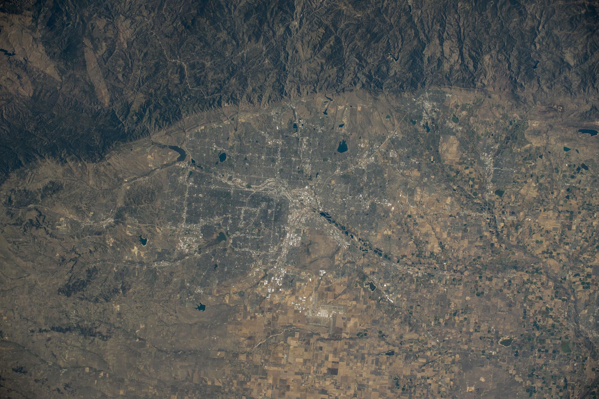 The Denver, Colorado, metropolitan area sits near the eastern foothills of the Rocky Mountains in this photograph from the International Space Station as it orbited 258 miles above the Centennial State.