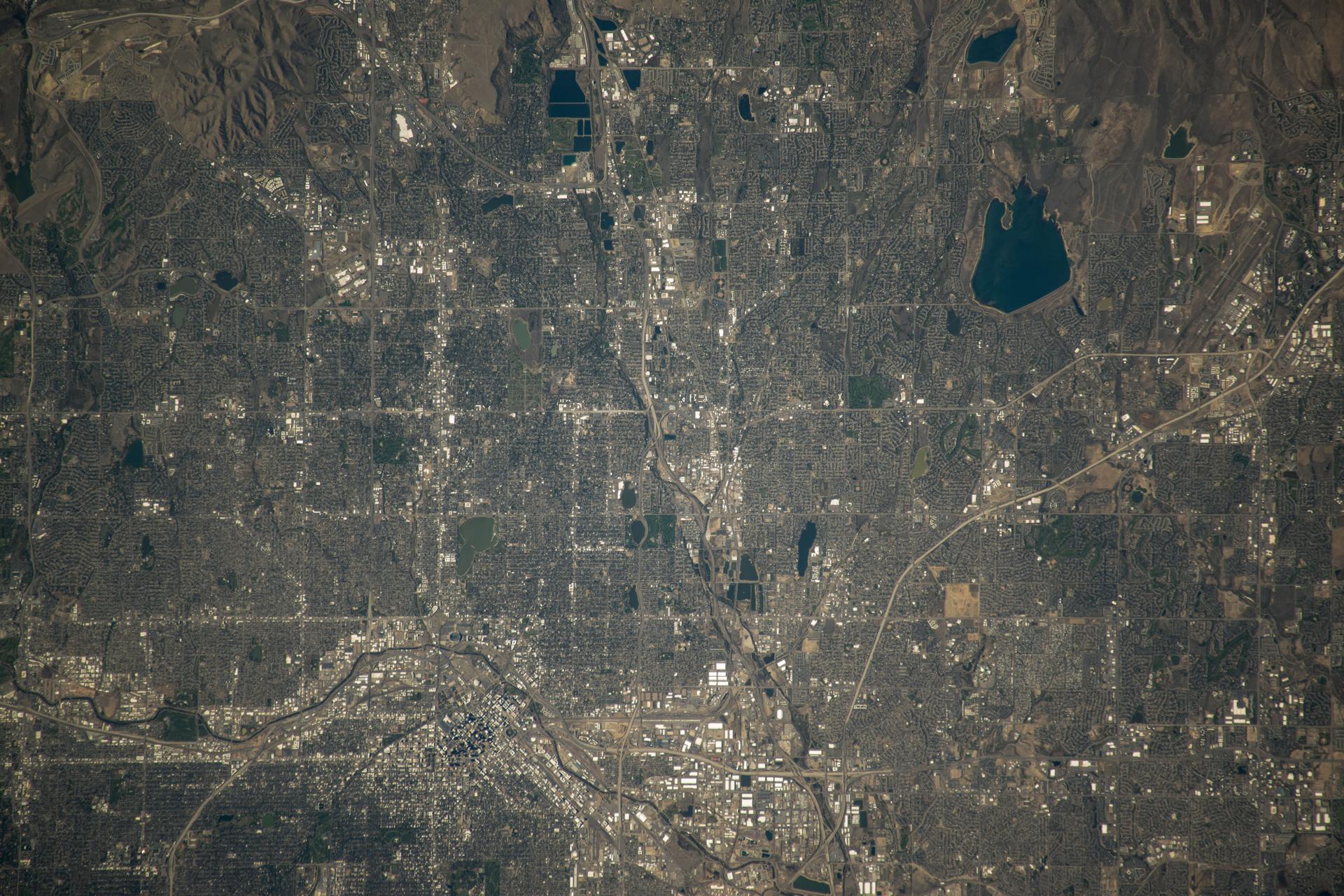 Denver, Colorado, split by the South Platte River, and with Standley Lake at top right, is pictured from the International Space Station as it orbited 258 miles above the Centennial State.