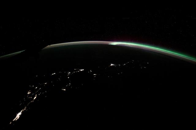 NASA image: The aurora australis blends with Earth's atmospheric glow